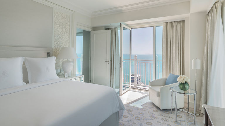 A sea-view guestroom faces the Arabian Gulf.