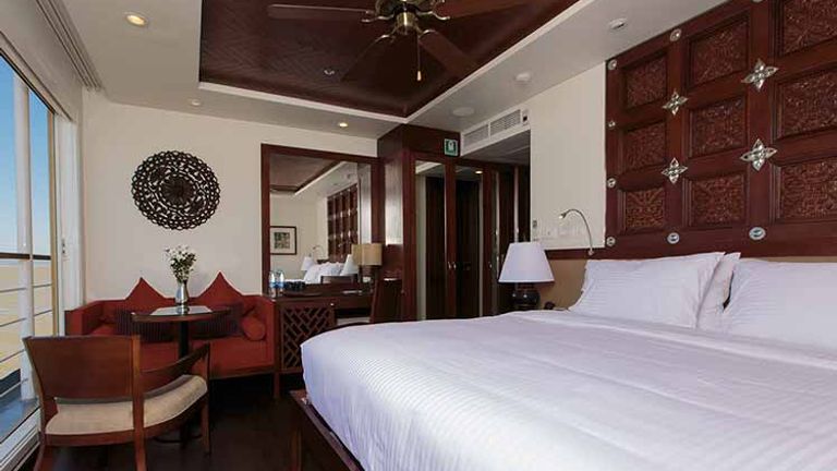 Stateroom on Avalon Myanmar feature large sliding-glass windows. // © 2016 Avalon Waterways