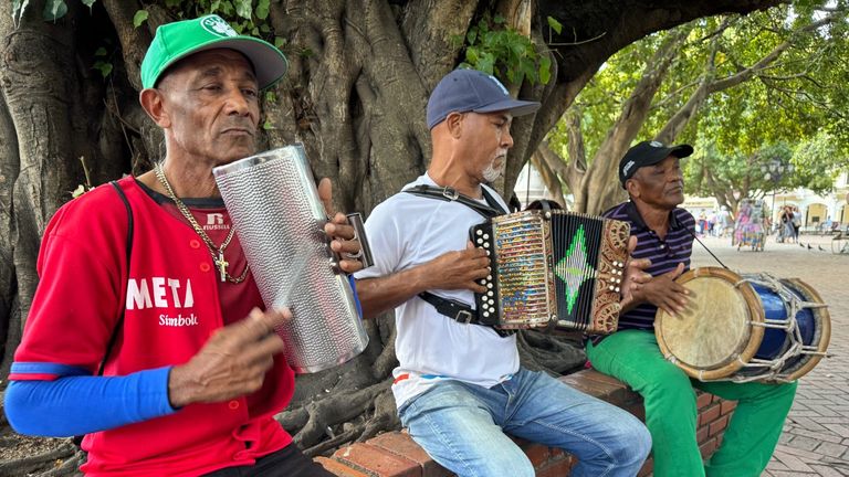 Street musicians in downtown Santo Domingo entertain locals and tourists.