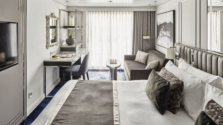 The 219-square-foot Riverside Suite includes a king-size bed, a French balcony and a heated Toto toilet.